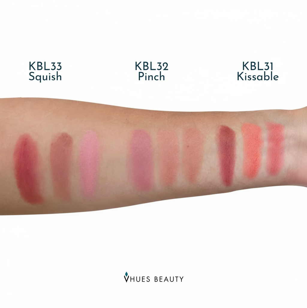Lip color swatches on a arm with 'Vhues Beauty' branding