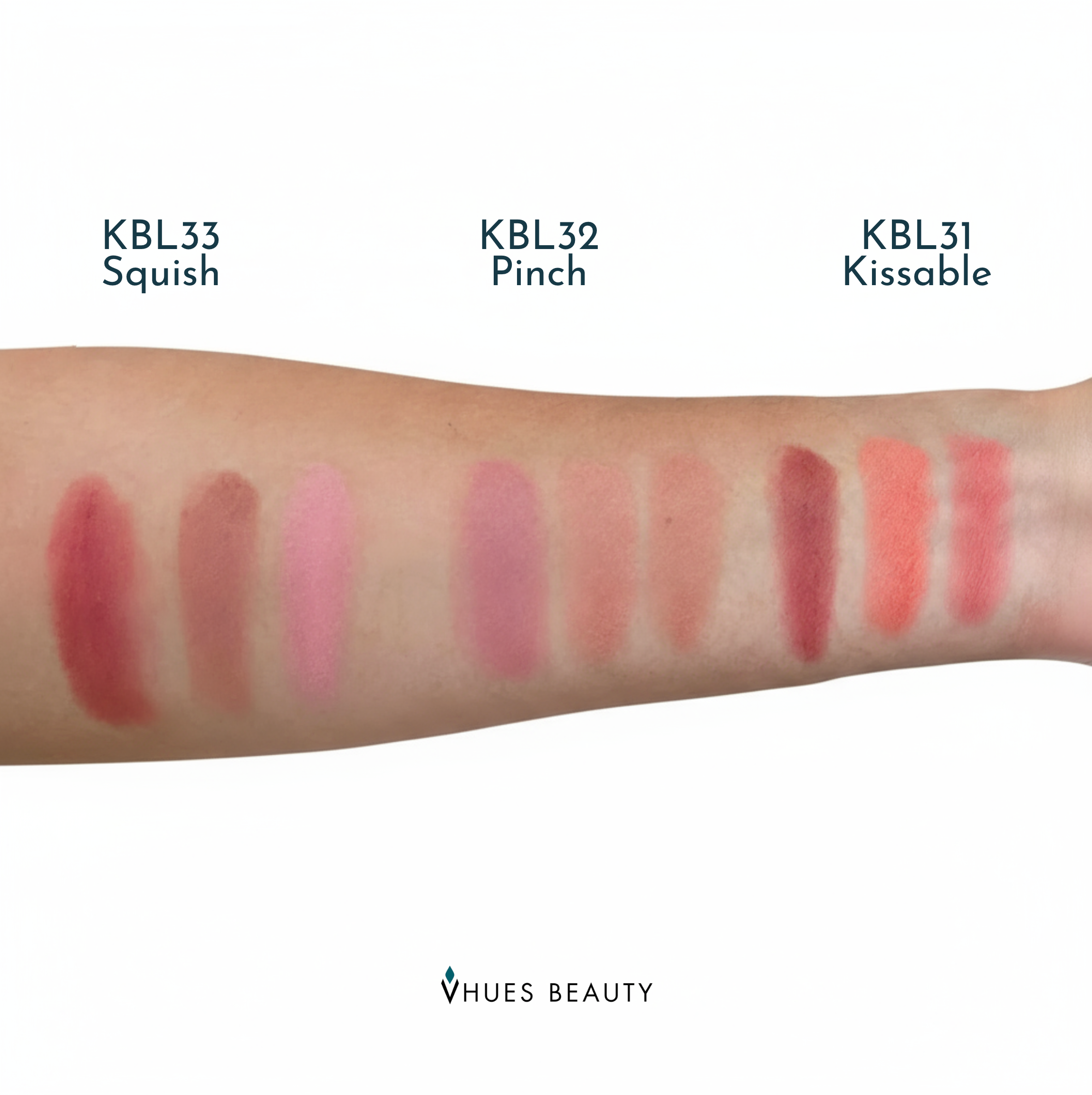 Lip color swatches on a arm with 'Vhues Beauty' branding