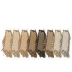 Set of eight eyeshadow swatches in neutral tones on a white background